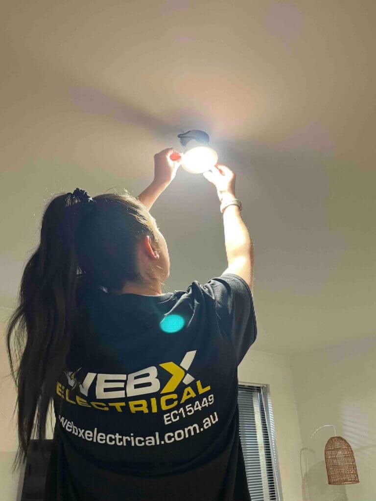 Electrician installing an LED downlight in a Perth home — Web X Electricians Perth