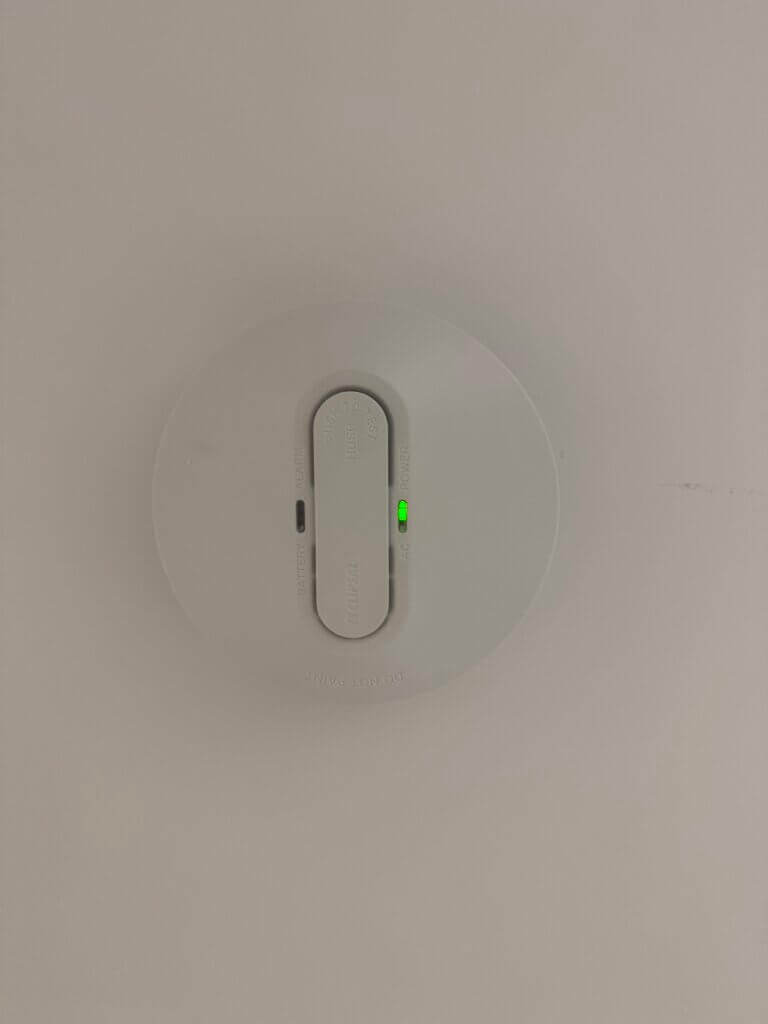 Hard-wired smoke alarm on a Perth ceiling